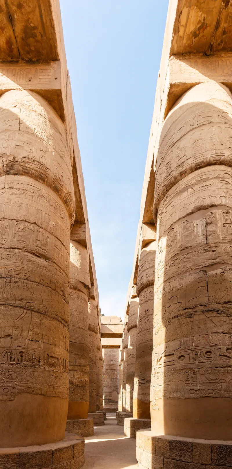 Looking up between the giant columns of the Great Hypostyle Hall at Karnak.