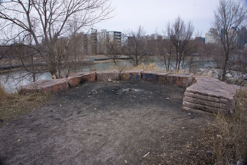 An outdoor fire pit in a park.
