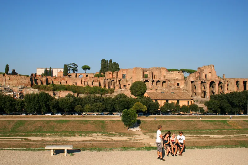 The Circus Maximus in Rome today, a long grassy park below the ruins of the emperors' palace on the Palatine Hill.
